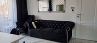 Stylowa sofa pikowana chesterfield funkcja spania