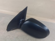 Kia Sedona and mirror left