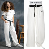 Spodnie dresowe sportowe active spadochronowe bawełna białe dziewczęce 152