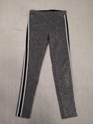 Srebrne błyszczące spodnie legginsy H&M 146