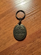 Brelok - OKOCIM - likwidacja zbiorów.