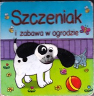 Szczeniak i zabawa w ogrodzie. Praca zbiorowa