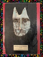 Ceramiczny kot na opalanej desce.