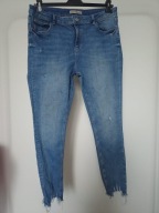 spodnie dżins niebieskie denim co 44 rurki poszarpane ze średnim stan