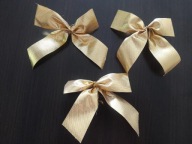 3 złote kokardy bożonarodzeniowe na choinkę