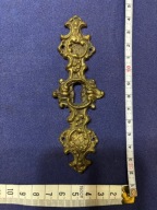 stary szyld z początku XX w. do mebelka wykonany z mosiądzu ładny kształt