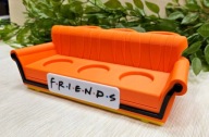 Sofa pomarańczowa kanapa ekspozytor na figurki FRIENDS z McDonalds