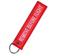 Breloczek REMOVE BEFORE FLIGHT 13cm czerwony
