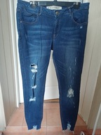 denim co 44 spodnie dżins poszarpane przetarcia rurki ze średnim stanem