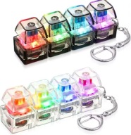 Świecący brelok antystresowy klawiatura 4 przyciski LED klik