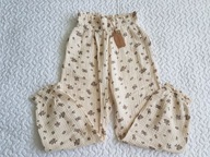 Newbie spodnie muslinowe beżowe w kwiatki nowa roz 122