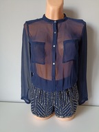 Śliczny kombinezon Trafaluc EUR XS