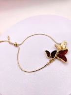 Bransoletka z motylami z bursztynu i srebra pozłacanego 24k złotem