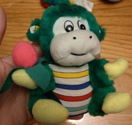 Zielona małpka małpa maskotka z różowym bananem owocem