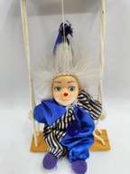 mały stary pajacyk na huśtawce - figurka