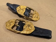 Dwie stare klamry do rapci do starej szabli XIX w. w kształcie głowy lwa