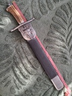 Tasak myśliwski - herb ,, Pomian ''