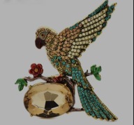 Broszka ptak z błyszczącymi kryształkami