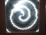 Srebrny obraz w metalowej ramie i szkle 57/57 cm Efekt ruchu