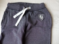 H&M dziecięce spodnie dresowe szare r 140