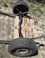 OŚ BELKA ZAWIESZENIE RESORY TYŁ VW CADDY III 2K0500051A 2K0511151M