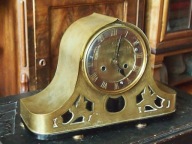 Napoleon - zegar kominkowy w mosiężnej obudowie.