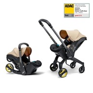 Fotelik samochodowy Doona i beżowy 0-13 kg tyłem do kierunku jazdy