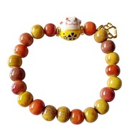Ceramiczna bransoletka "Maneki Neko i Kocia Łapka" - pomarańczowo-żółta