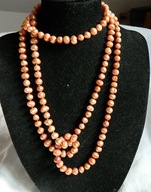 Pomarańczowe, naturalne perły, długi sznur pereł, naszynik