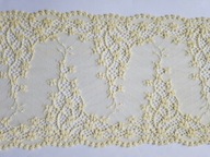 Koronka elastyczna na tiulu żółta szerokość 16cm.