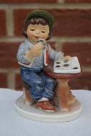 Goebel - chłopiec z klaserem monet.