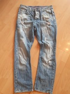 SPODNIE JEANSOWE CARROT JEANS DZIURY