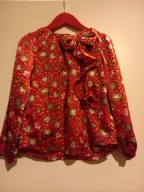 Piękna bluzka z falbaną 104/110