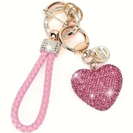 Różowy pleciony brelok / smycz z serduszkiem i błyszczącymi kryształkami