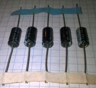 Kondensatory osiowe INTERCAP 10uF 50V 85st.C nowe NOS zestaw 5szt