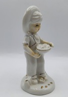 biało-złota chłopiec trzyma misę przecudna buzia