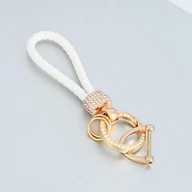 Biały pleciony brelok z kryształkami – elegancki i modny dodatek do kluczy