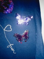 Piękna bluzka motyle cekiny 146/152