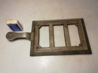 Stara żeliwna podstawka pod żelazko