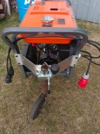 Agregat prądotwórczy - mocowanie i dodatkowe koło manewrowe