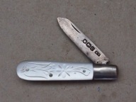 Srebrny scyzoryk do damskiej torebki.