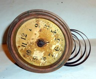 Stary mechanizm zegarowy z tarczą .