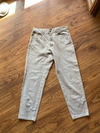 Beżowe spodnie jeansowe Angeis 42