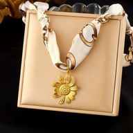 Naszyjnik damski zawiązywany z złotym kwiatem stal nierdzewna CLS59