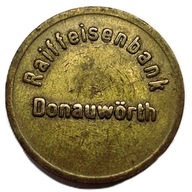 Żeton do nocnego sejfu z napisem "Ostertag"."Raiffeisenbank Donauwörth"