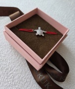 Srebrna bransoletka W.KRUK na czerwonym sznurku