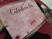 Zestaw prezentowy: voucher puzzle, długopis + woreczek