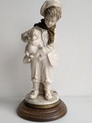 Figurka chłopca z psem porcelanowa
