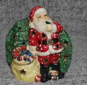 Świąteczny ceramiczny świecznik Św.Mikołaj z workiem prezentów