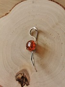 Srebrna broszka flaming z bursztynem bałtyckim koniakowym 